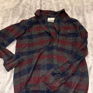 never worn red, blue, and grey flannel